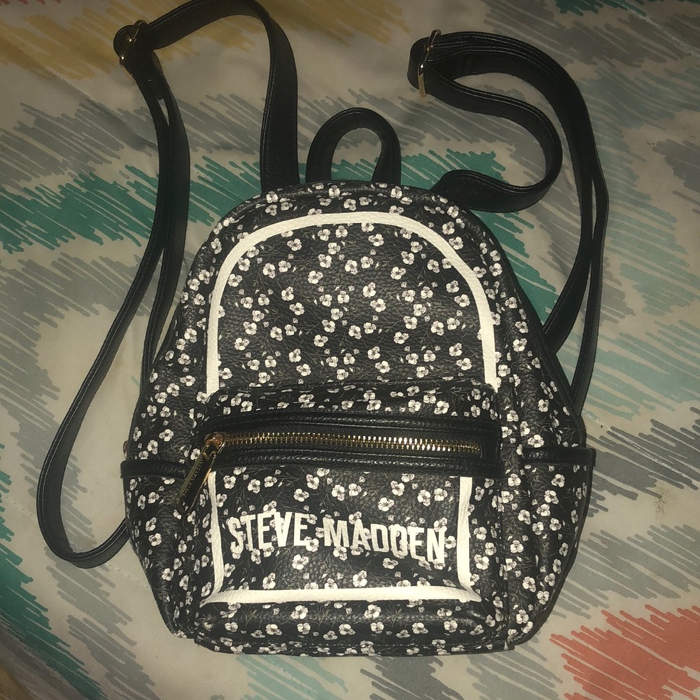 Mini Steve Madden backpack with flower decor.